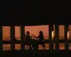 A couple enjoying the beautiful lushgreen view of one of the finest hotel in Maldives